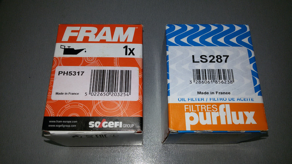 Два брата — Fram PH5317 и Purflux LS287. — Mitsubishi Lancer X. Запчасти на фото: PH5317, LS287