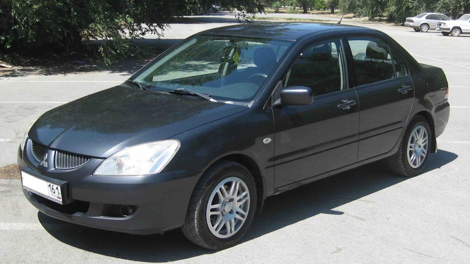 2003 отзывы. Mitsubishi Lancer 2003. Мицубиси Лансер 2003 года. Митсубиси ланцер 2003. Митсубиси ланцер 2003 год.