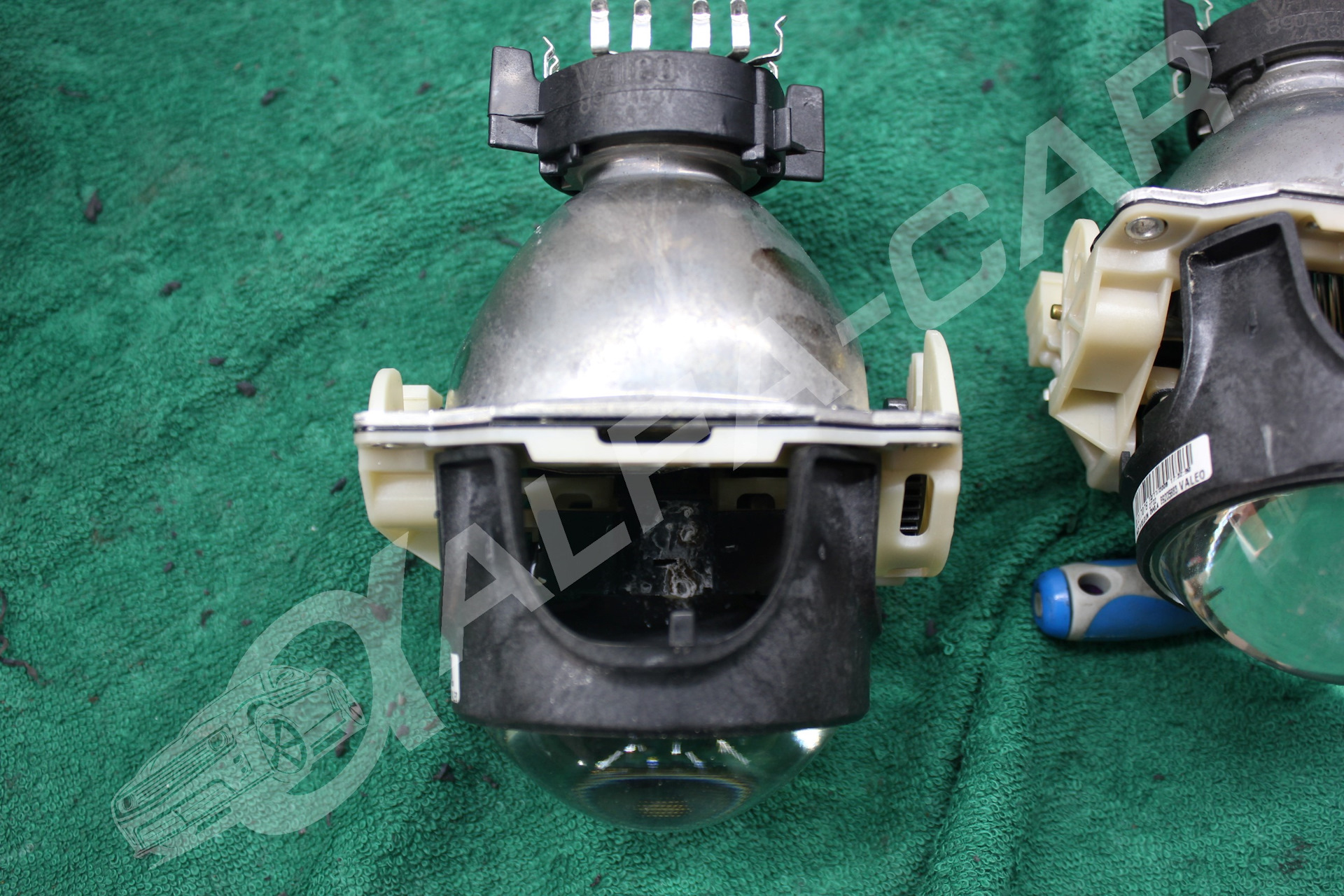 Шторка дальнего света. Шторка дальнего света. Крепеж линзы ближнего света в фаре мицубиси асх. 998-001. Линзы hella 2.