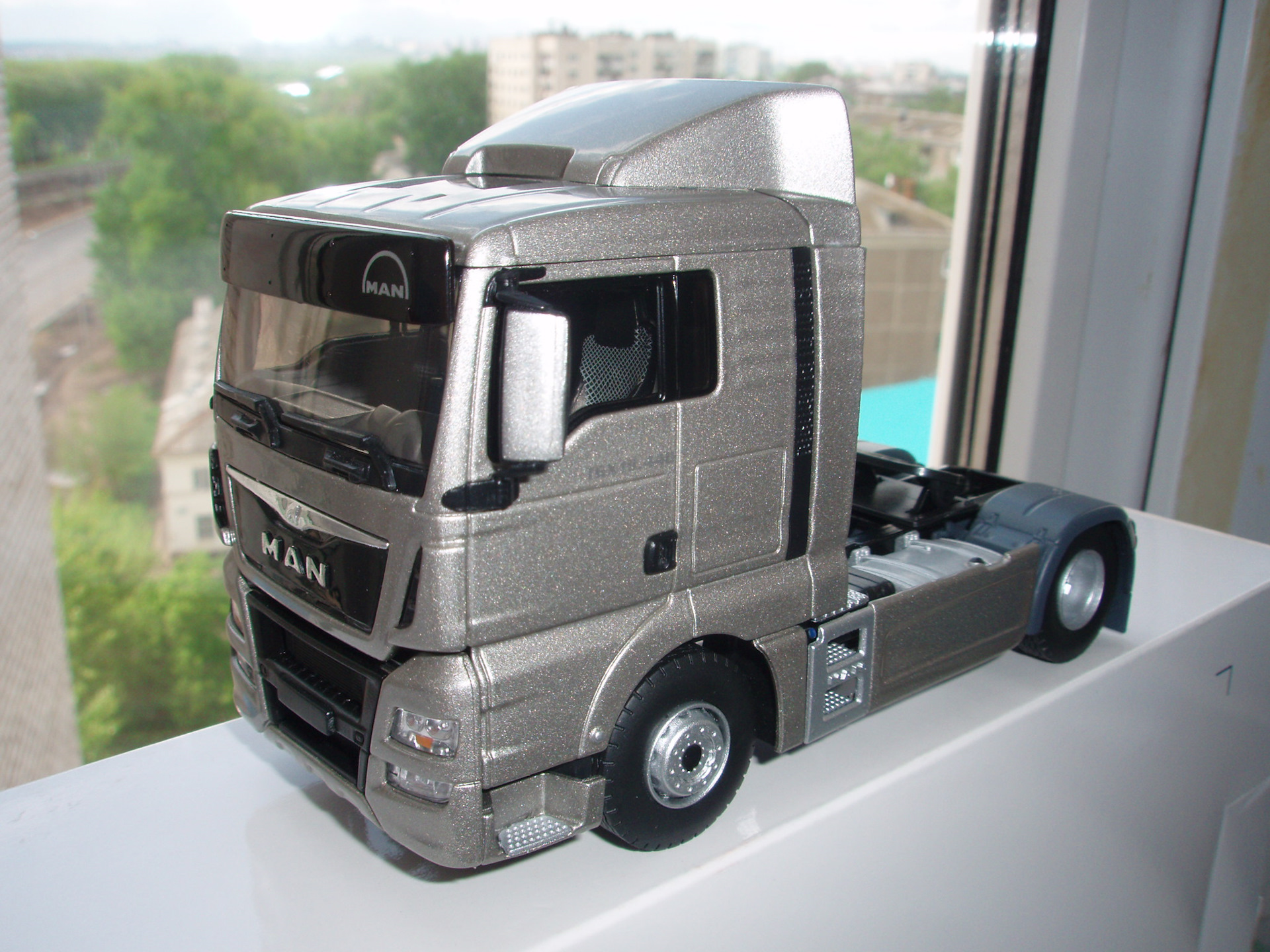 Ман модели. Man TGX 1:43. Модель 1 43 ман ТГС. Модель 1.43 man TGX 2021. Man TGX 2022 масштабная модель.