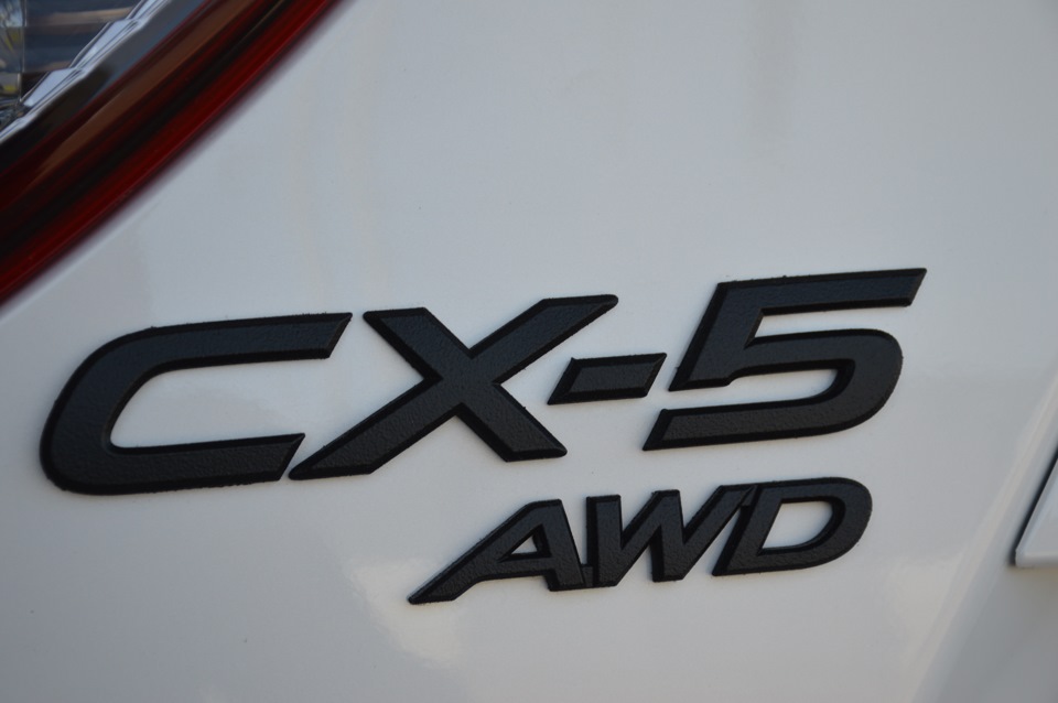 Значок сх. Mazda CX 5 шильдики. Мазда CX-5 лого. Эмблема Мазда сх5. Наклейки Mazda сх5.