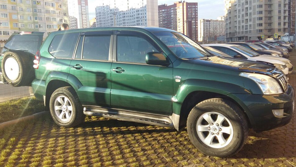 Прадо 120 дизель отзывы владельцев. Toyota Prado 120 зеленый. Ленд Крузер Прадо 120 темно зеленый. Тойота Прадо 120 темно зеленая. 120 Тойота ленд Крузер зеленая.