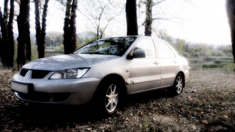 renault laguna 2 или mitsubishi lancer 9 renault laguna 2 или mitsubishi lancer 9