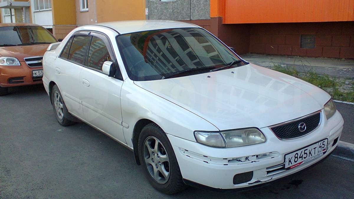 Автомобиль капелла. Mazda Capella 1999. Мазда капелла 1999 седан. Мазда капелла 1999 года седан. Мазда капелла 2.0.