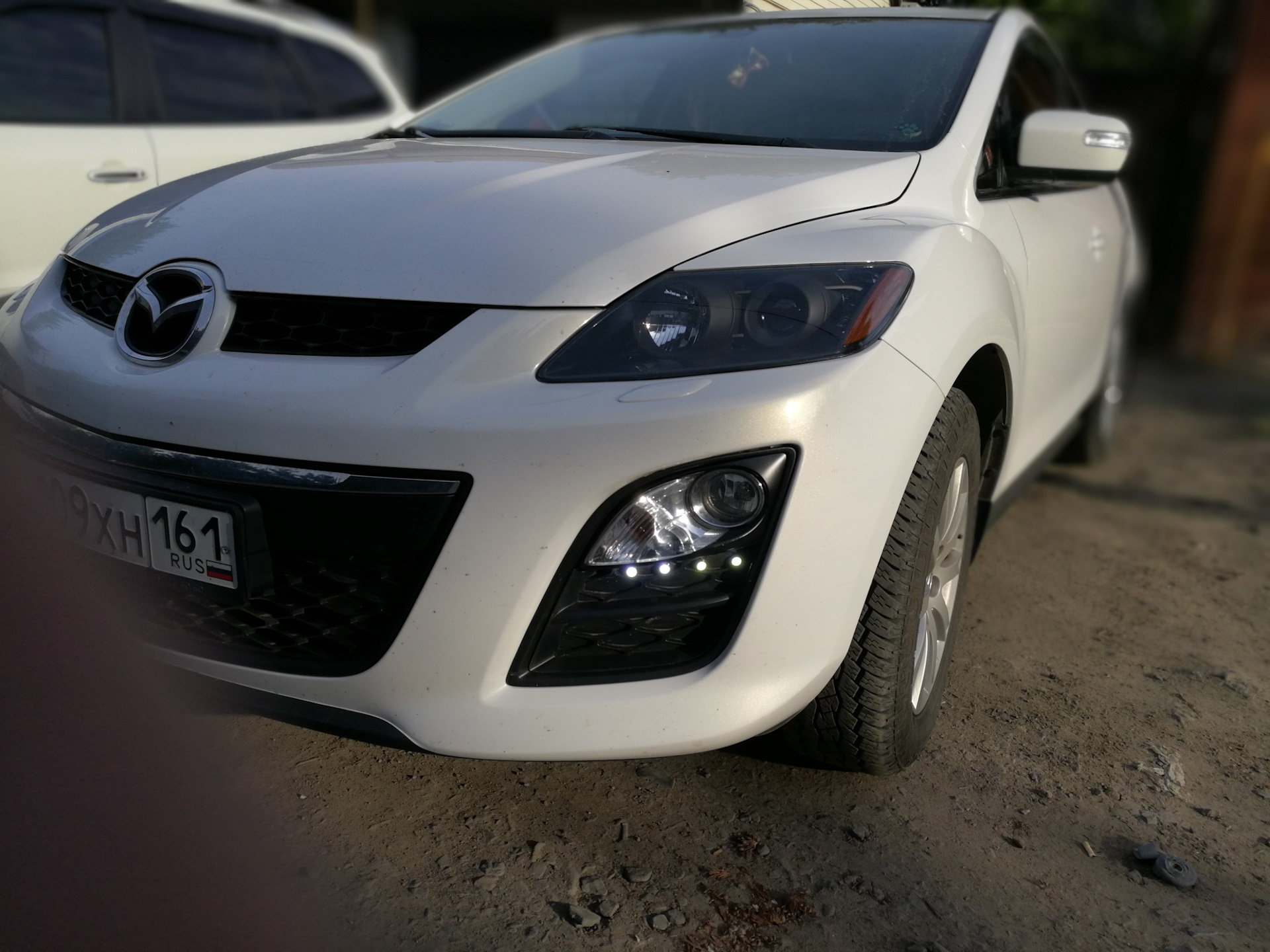 Mazda cx 7 фары. Mazda CX 7 черные фары. Mazda cx7 2011 2.5 bamper. Mazda CX-7 2011. Cx7 Mazda 2008 ПТФ.