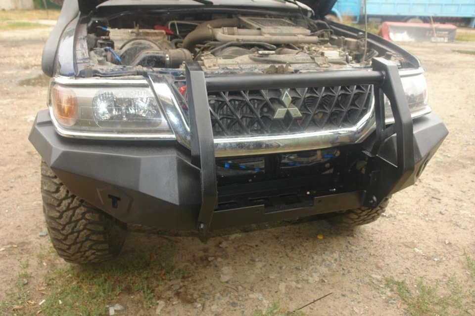 Бампер pajero. Mitsubishi Pajero Sport 3 2022 силовой бампер. Силовые бампера на Митсубиси Паджеро 2010. Силовой бампер передний на Митсубиши Паджеро спорт 2. Силовые бампера Mitsubishi Montero III.
