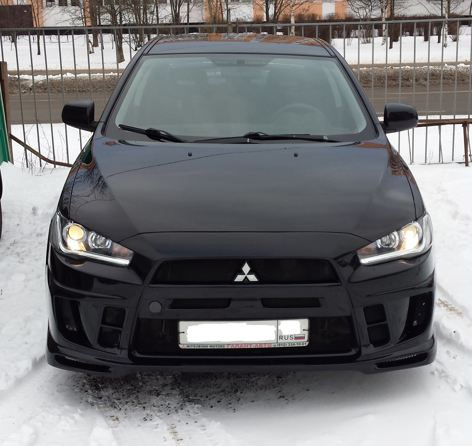 Фары мицубиси лансер. Mitsubishi Lancer 2008 обвесы. Лансер 10 в обвесе черный. Бампер экстрим на Лансер 10 черный. Mitsubishi Lancer 10 с обвесом черный.