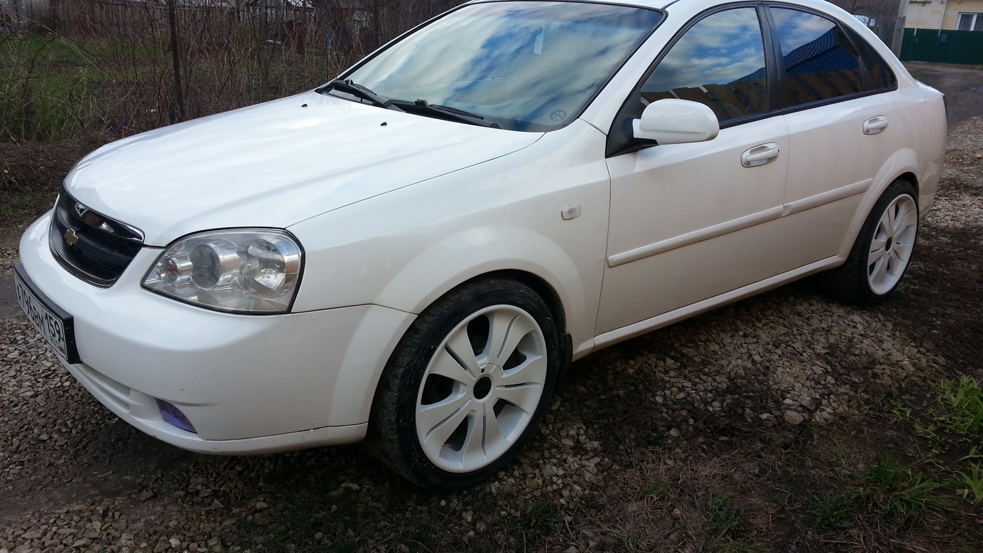 Chevrolet Lacetti 1.8 белый тонировка