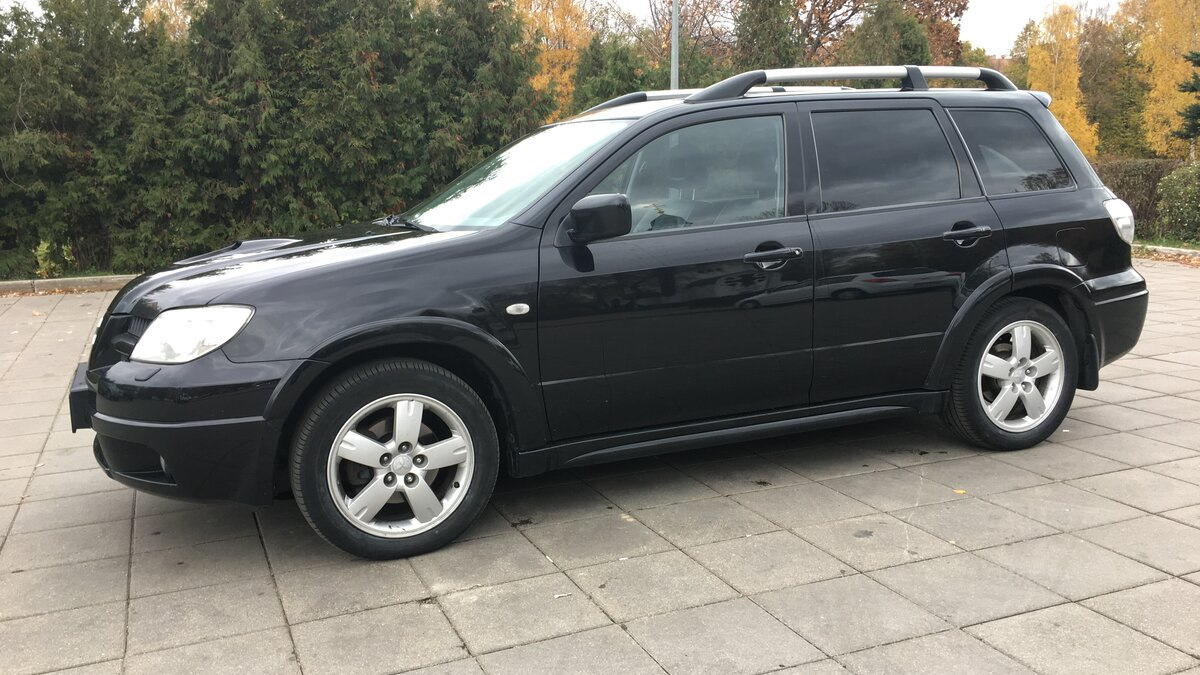 Mitsubishi Outlander (1G) 2.4 бензиновый 2007 | 2.4 на акпп цвет черный на  DRIVE2