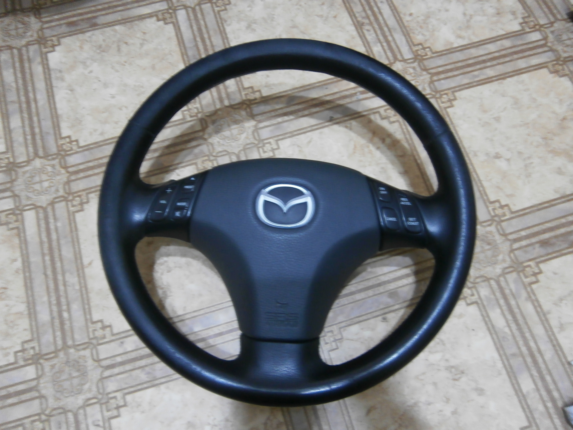 Мазда какой руль. Руль мазда 3 2021. Оплётка на руль мазда демио. Руль мазда 323. Оплетка на руль мазда 323 1995 4 спицы.