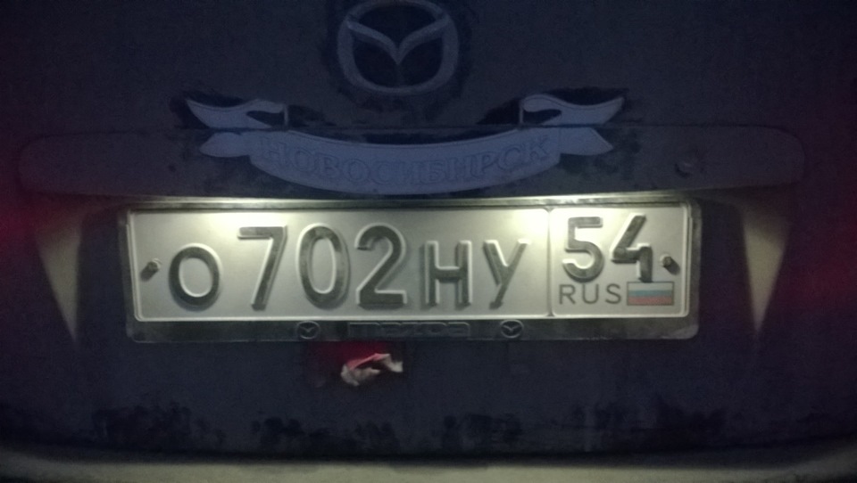 Подиум номера мазда. Лампочки подсветки номера Мазда 6 2014. Подиум номерного знака Mazda 6 GH. Рамка номерного знака Мазда Премаси. Площадка номерного знака xedos 6.