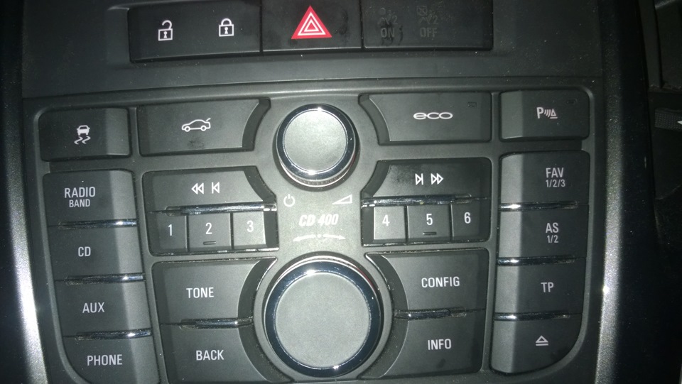 Opel astra h кнопки. Кнопка спорт Opel Astra j. Opel Astra j кнопки на панели.