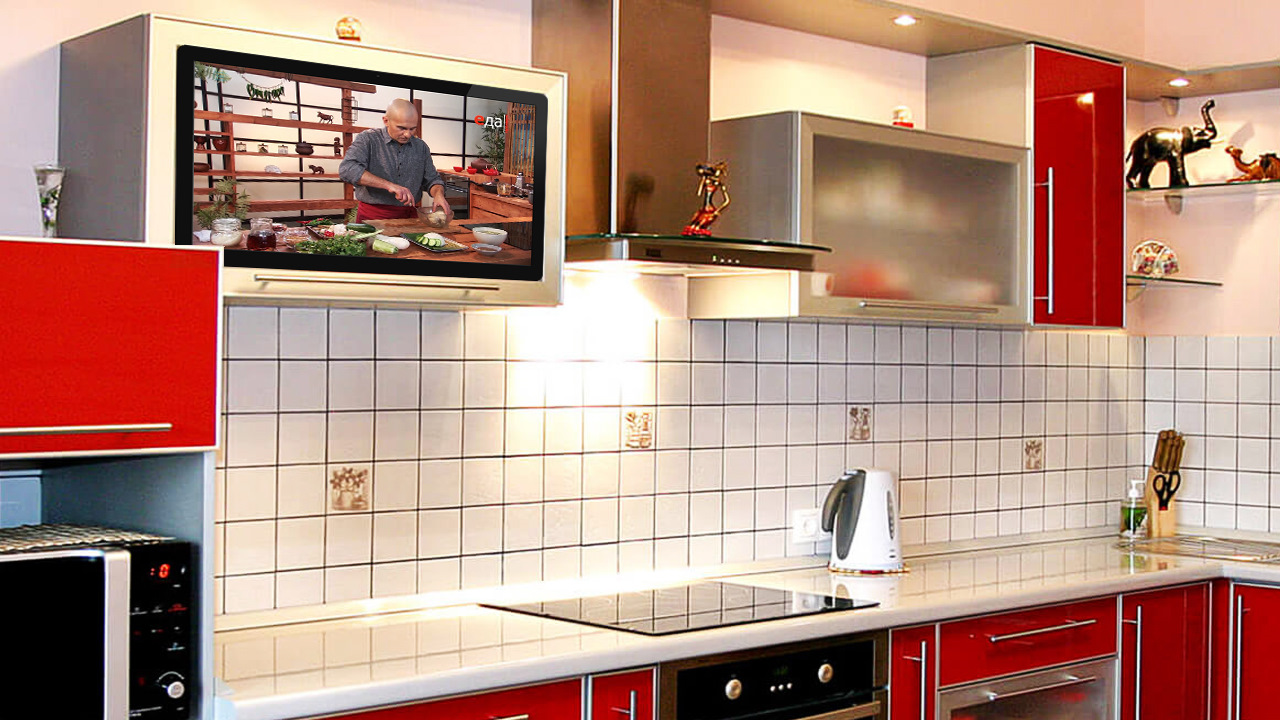 Встроенные телевизоры для кухни. Встраиваемый телевизор для кухни. Телевизор встроенный в кухню. Телевизор встроенный в кухонный фасад. Телевизор в кухонном фасаде.