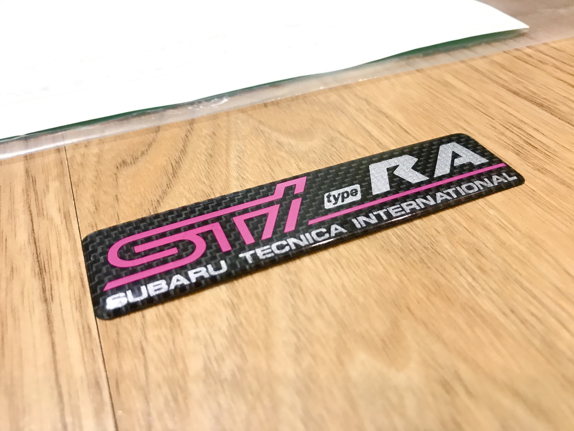 Side stick. STI 2m эмблема. Нашивка STI. Шильдик STI. Шеврон STI.