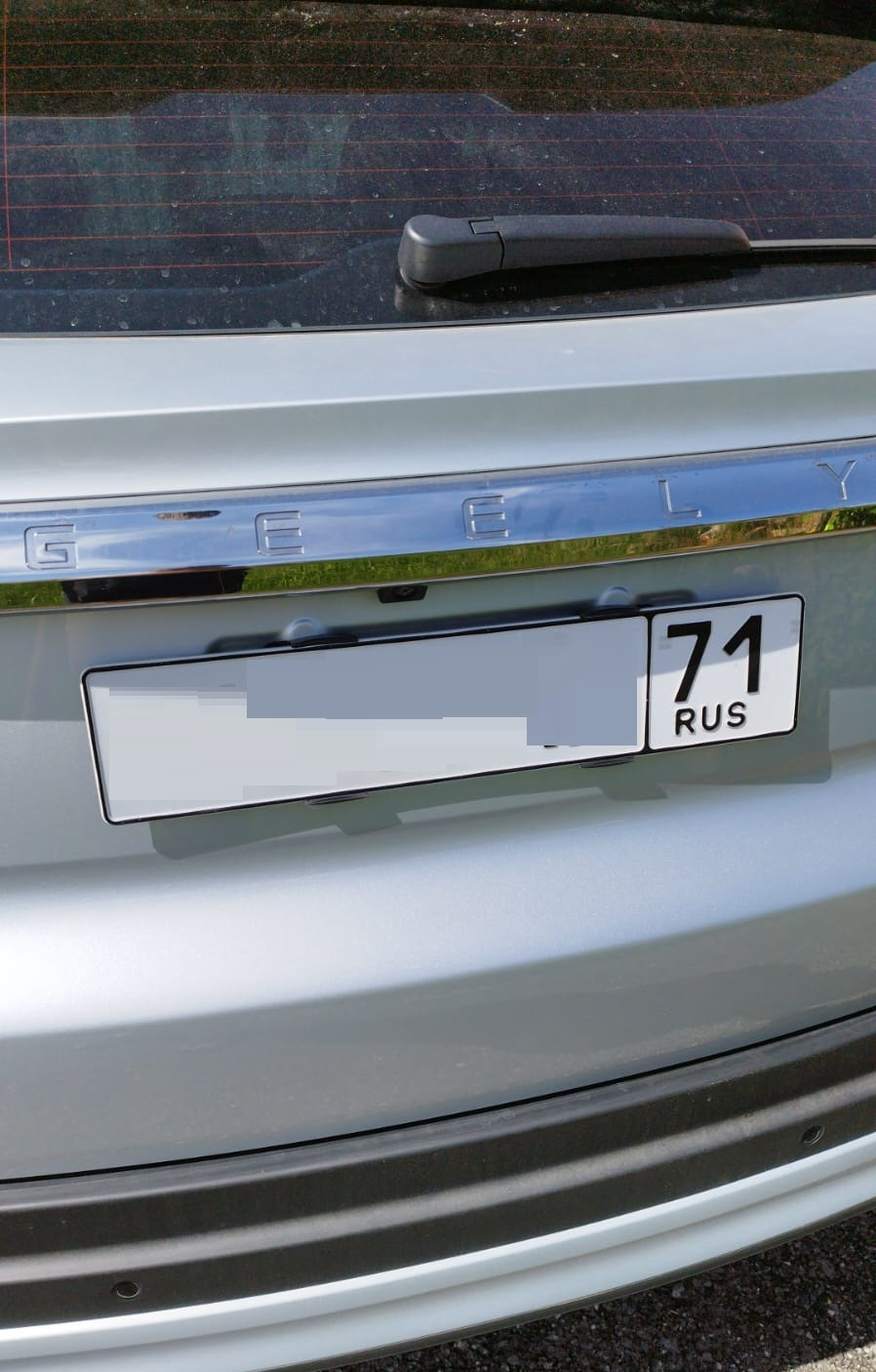 Невидимые номерные рамки, оклейка пленкой — Geely Atlas Pro, 1,5 л ...
