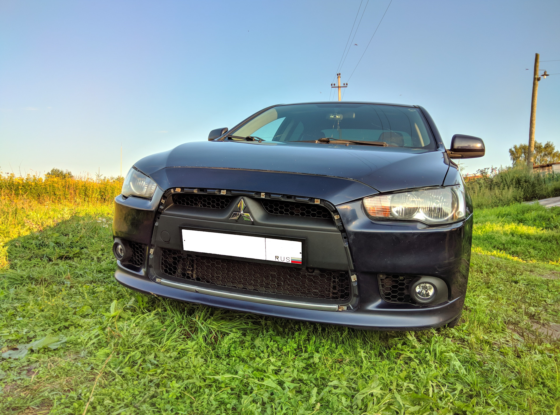 Мицубиси лансер 10 замена. Mitsubishi Lancer 10 Chrome. Лансер 10 хром. Бампер Лансер 10 Эво стиль. Хром переднего бампера Лансер 10.