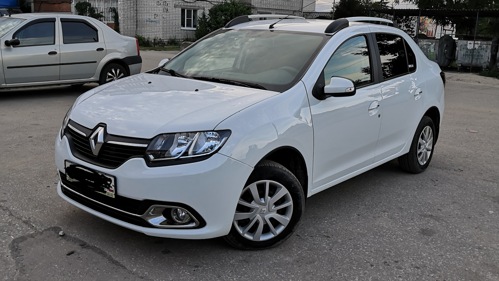 Renault logan 2. Renault Logan II 2014. Рено Логан 2 белый. Рено Логан 2 2014.